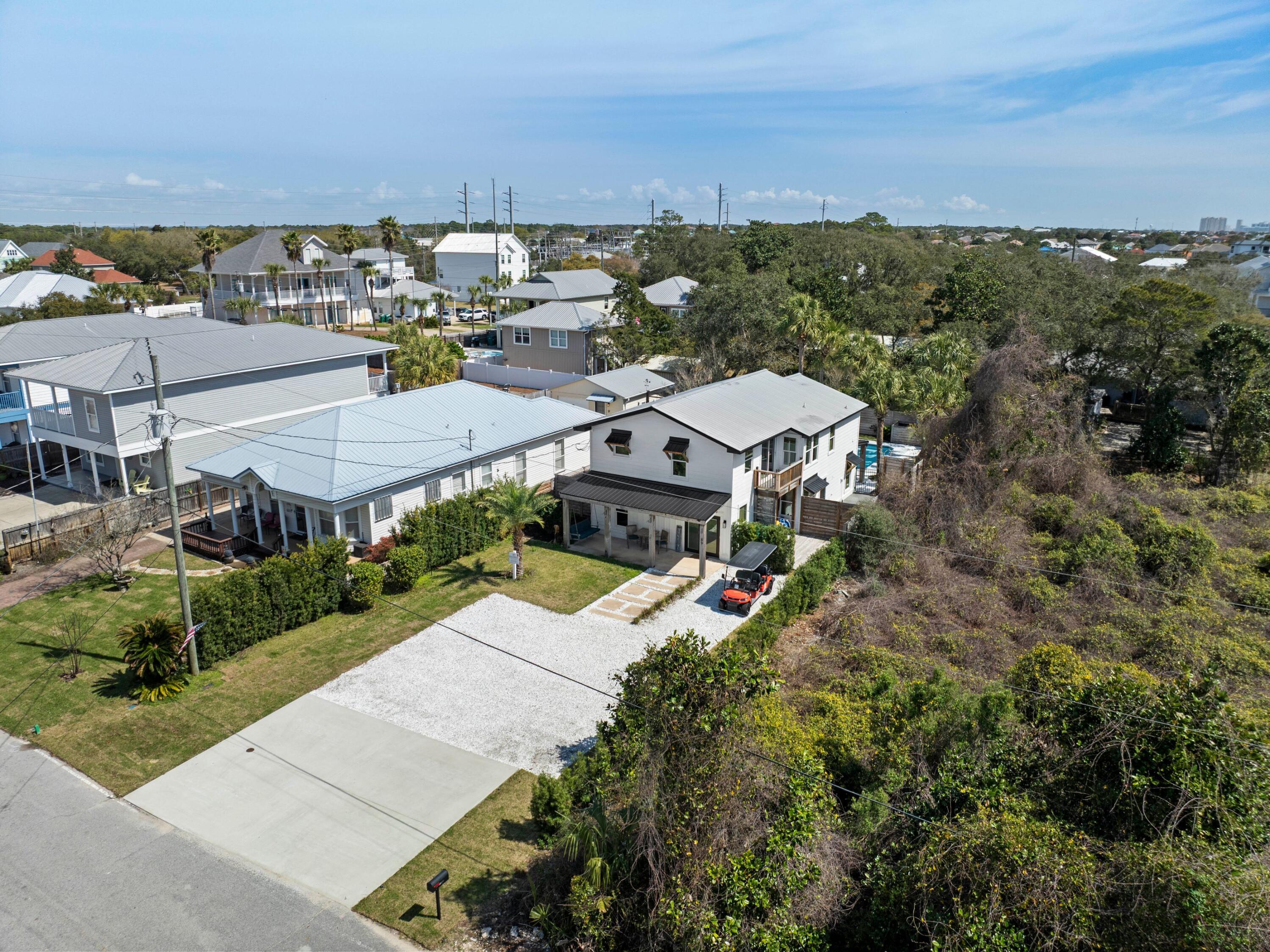 89 Tarpon Street Destin, FL 32541 - Photo 9 of 53 an aerial view of a house with a garden