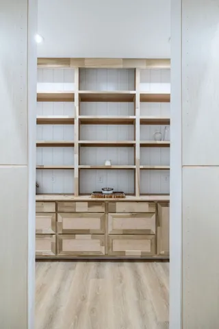 a stove top oven sitting inside of a kitchen and sink