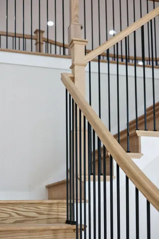 an aerial view of a house with swimming pool and ocean view