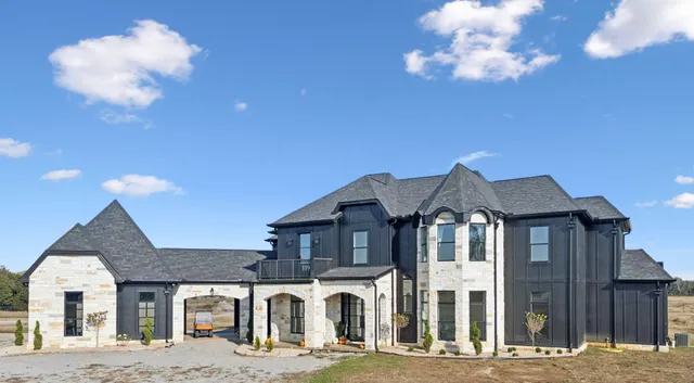 a view of staircase with wooden floor and white walls
