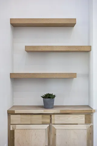 a kitchen with stainless steel appliances kitchen island granite countertop a sink and cabinets