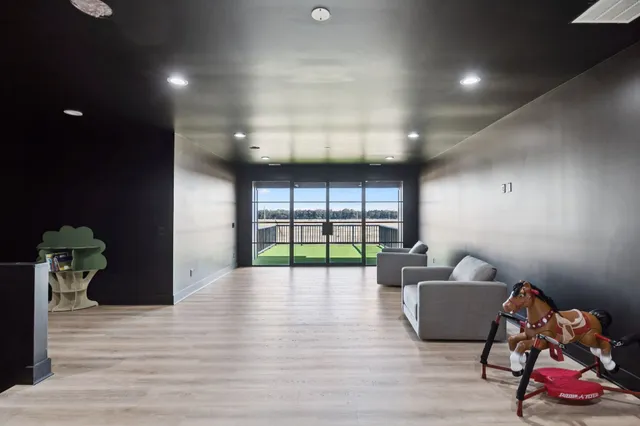 a living room with furniture and a table