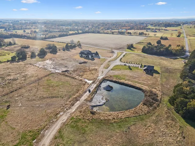 a view of a kitchen with a sink and a window