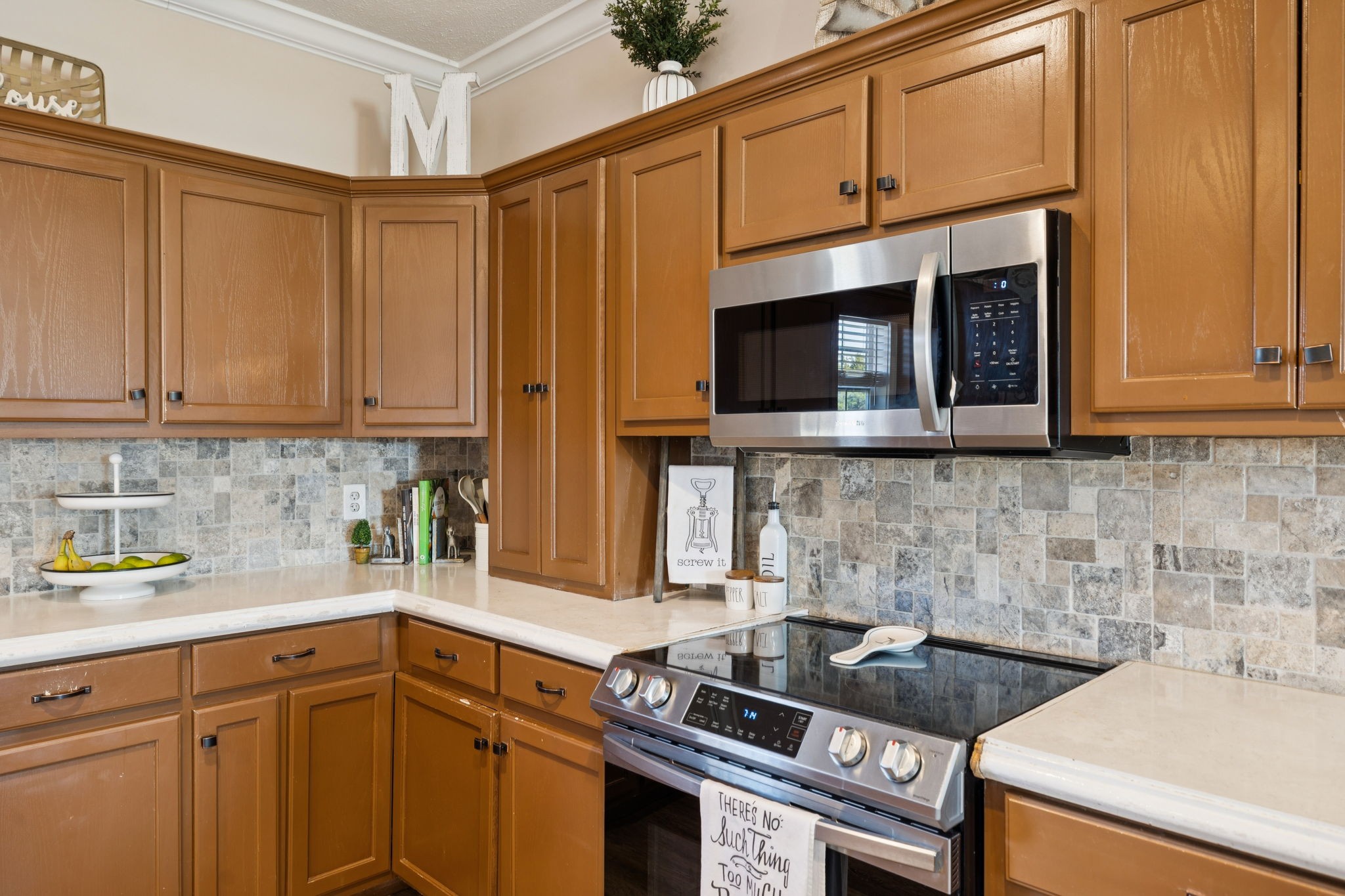 201 Lamb Road Rockvale, TN 37153 - Photo 49 of 87 a kitchen with stainless steel appliances granite countertop a stove a microwave and cabinets