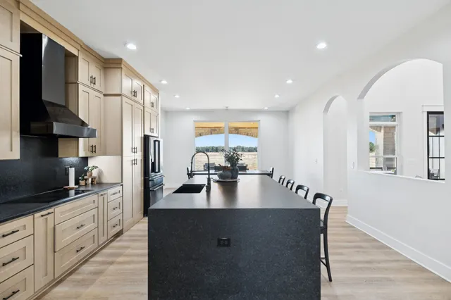 a view of a patio with a table and chairs and couches
