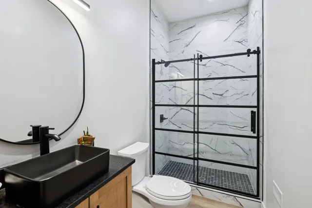a kitchen with stainless steel appliances a refrigerator and cabinets