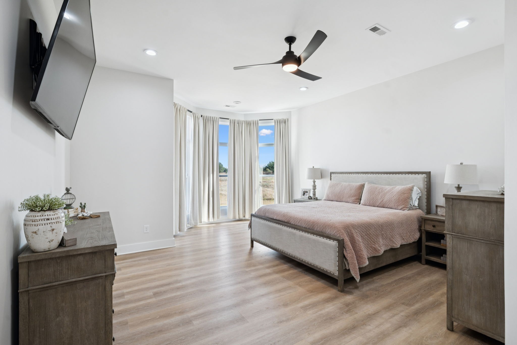 201 Lamb Road Rockvale, TN 37153 - Photo 10 of 87 a spacious bedroom with a bed and a flat screen tv