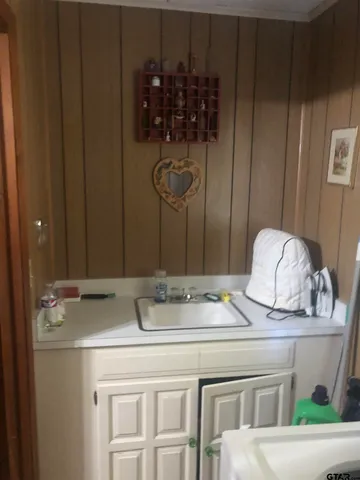 a kitchen with a sink and cabinets