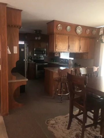 a room with lots of chairs and mirrors