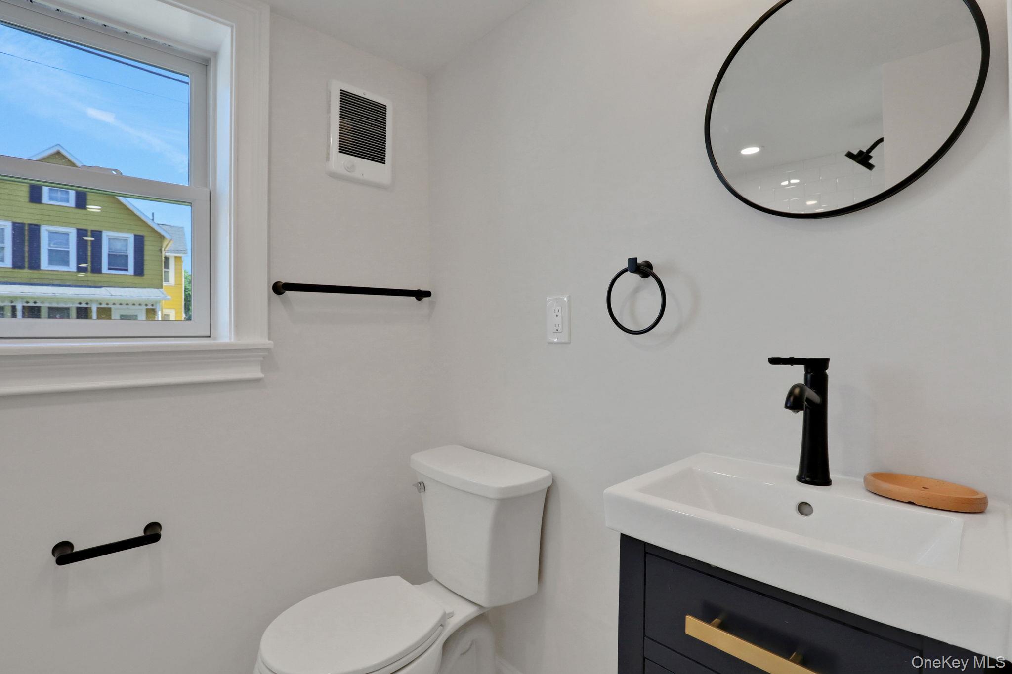 32 Ackerman Street Beacon, NY 12508 - Photo 14 of 37 a bathroom with a toilet and a sink