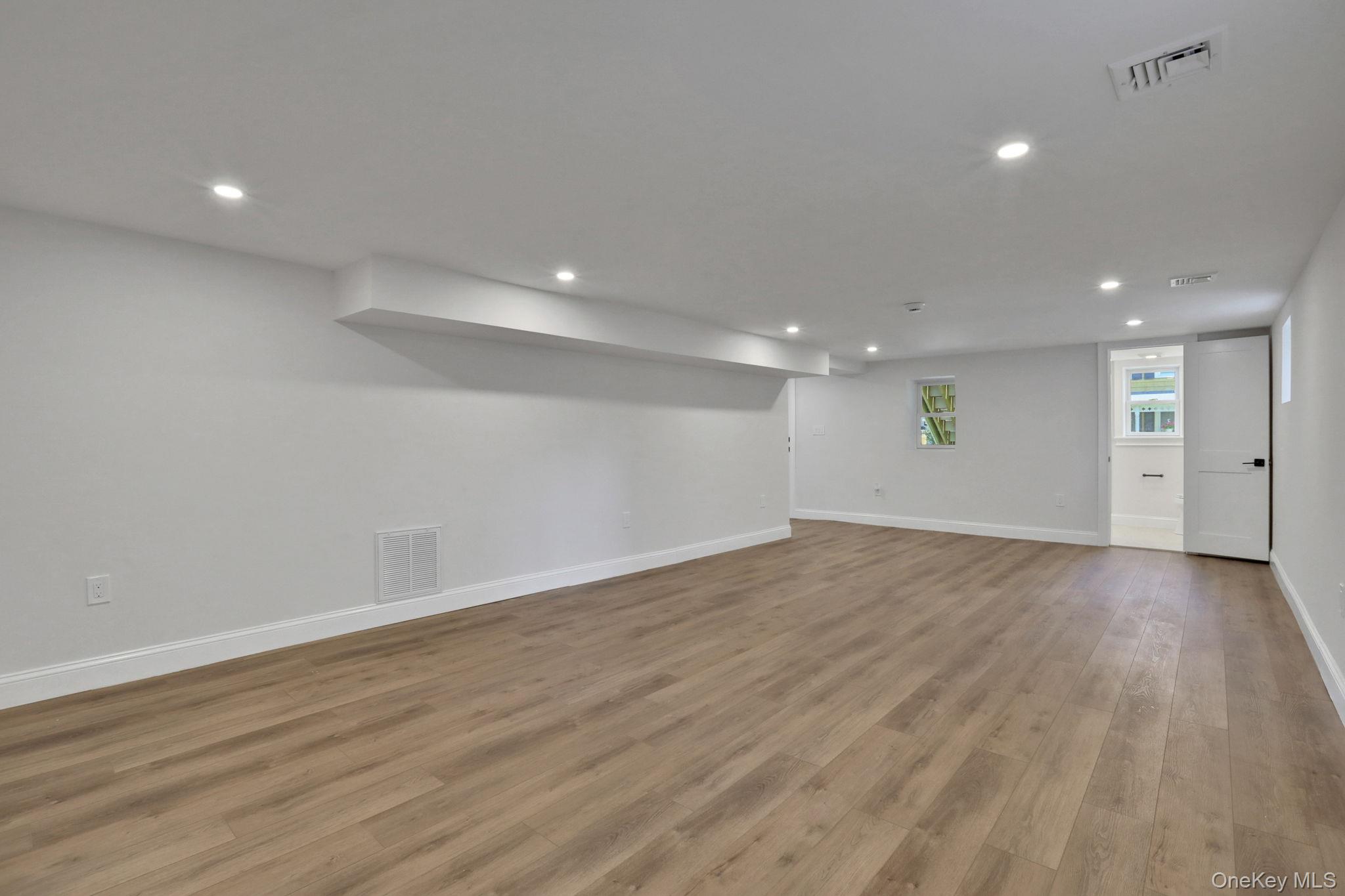 32 Ackerman Street Beacon, NY 12508 - Photo 17 of 37 a view of an empty room with wooden floor
