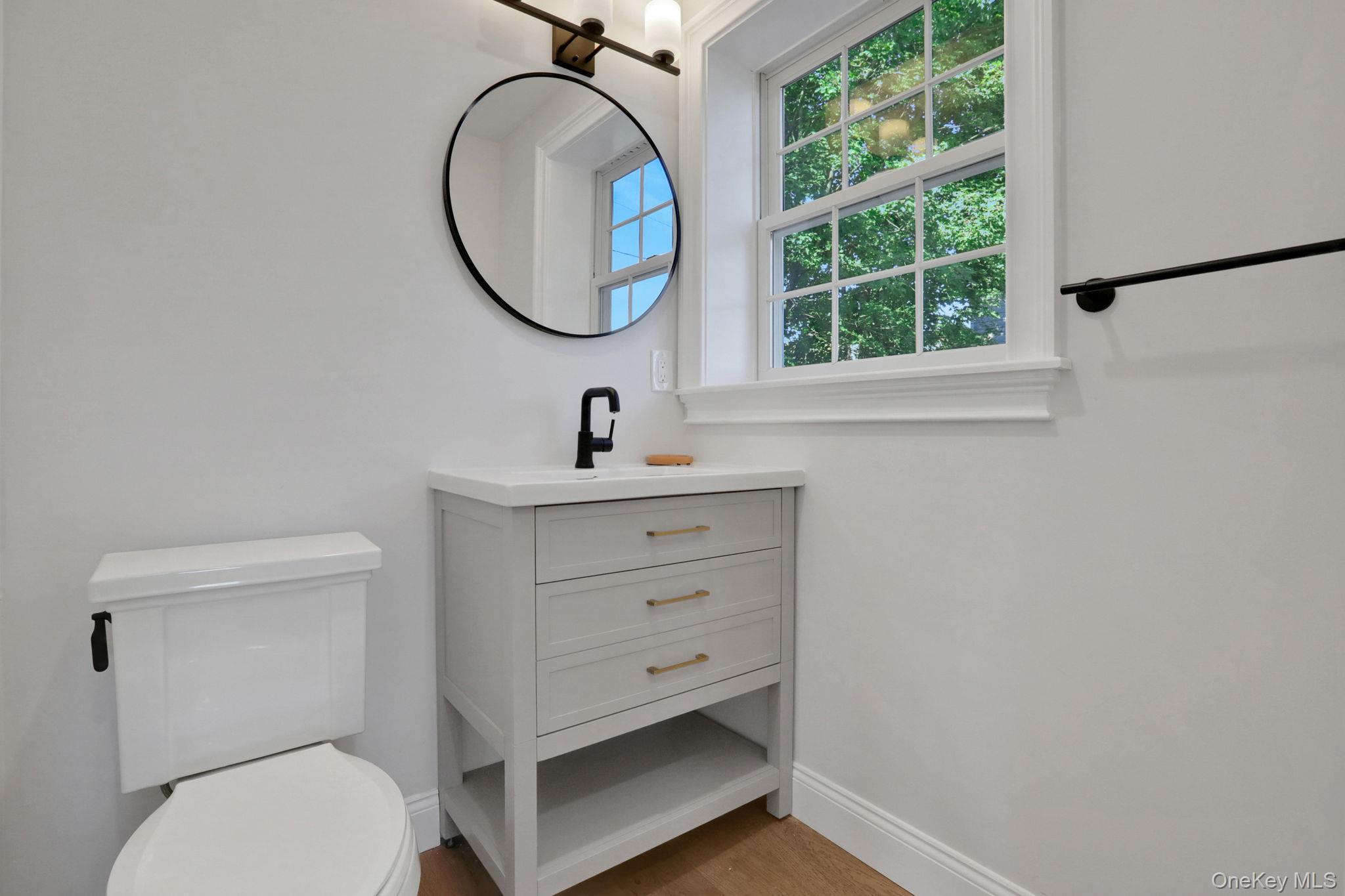 32 Ackerman Street Beacon, NY 12508 - Photo 19 of 37 a bathroom with a toilet a sink and a window
