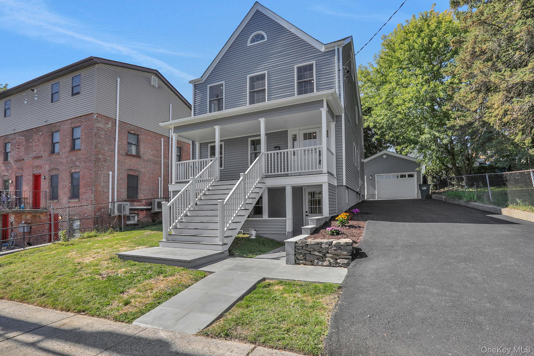 32 Ackerman Street Beacon, NY 12508 - Photo 2 of 37 front view of a house with a yard