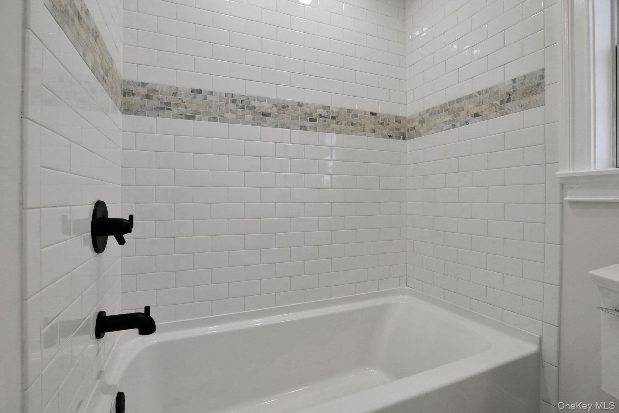 32 Ackerman Street Beacon, NY 12508 - Photo 20 of 37 a close up of a bathtub curtain