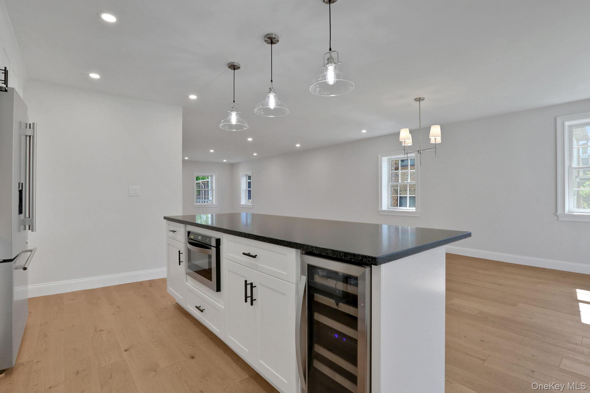 32 Ackerman Street Beacon, NY 12508 - Photo 5 of 37 a kitchen with stainless steel appliances granite countertop a sink and stove top oven