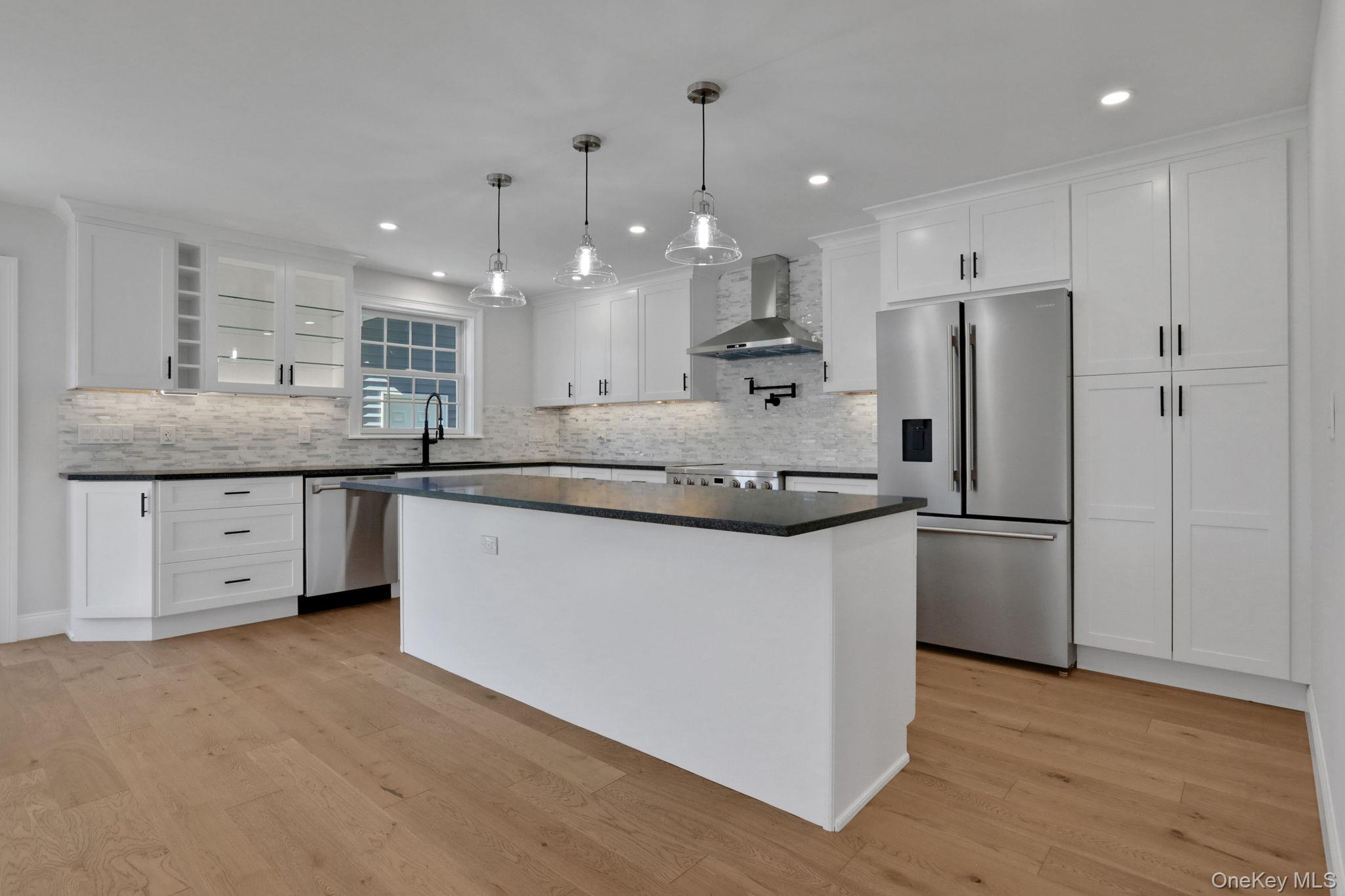 32 Ackerman Street Beacon, NY 12508 - Photo 8 of 37 a kitchen with stainless steel appliances granite countertop a sink a refrigerator and a stove