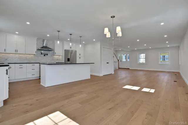 a picture of a bench in front of a wall