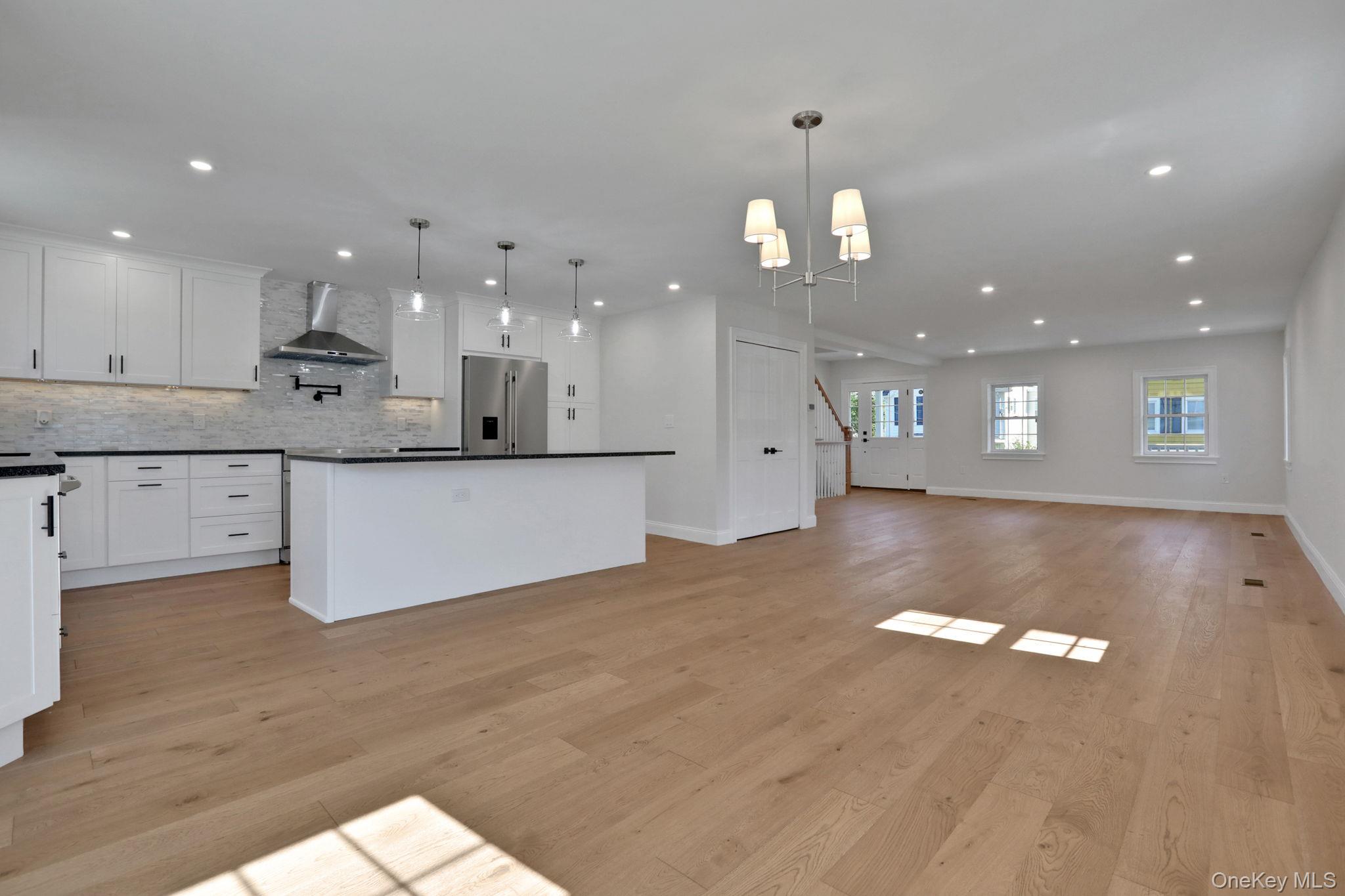 32 Ackerman Street Beacon, NY 12508 - Photo 35 of 37 a view of kitchen with kitchen island white cabinets and stainless steel appliances