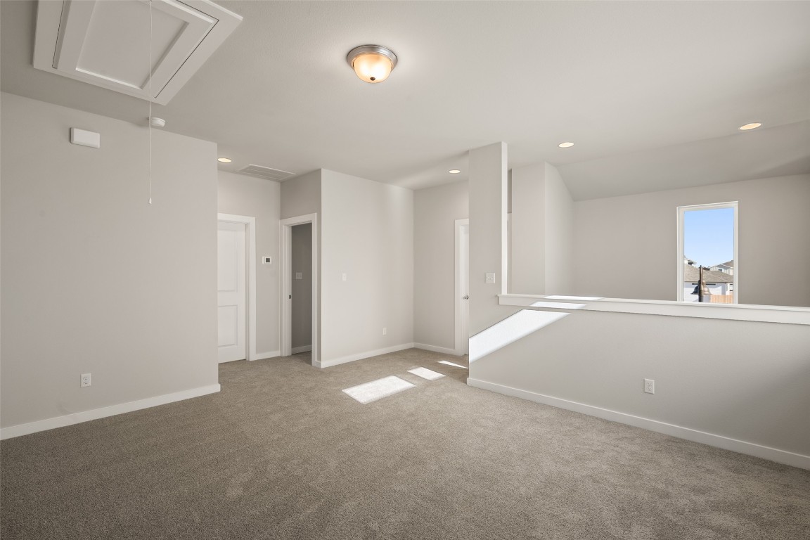 17408 Monastrell Lane Pflugerville, TX 78664 - Photo 14 of 31 an empty room with window and pillar in it