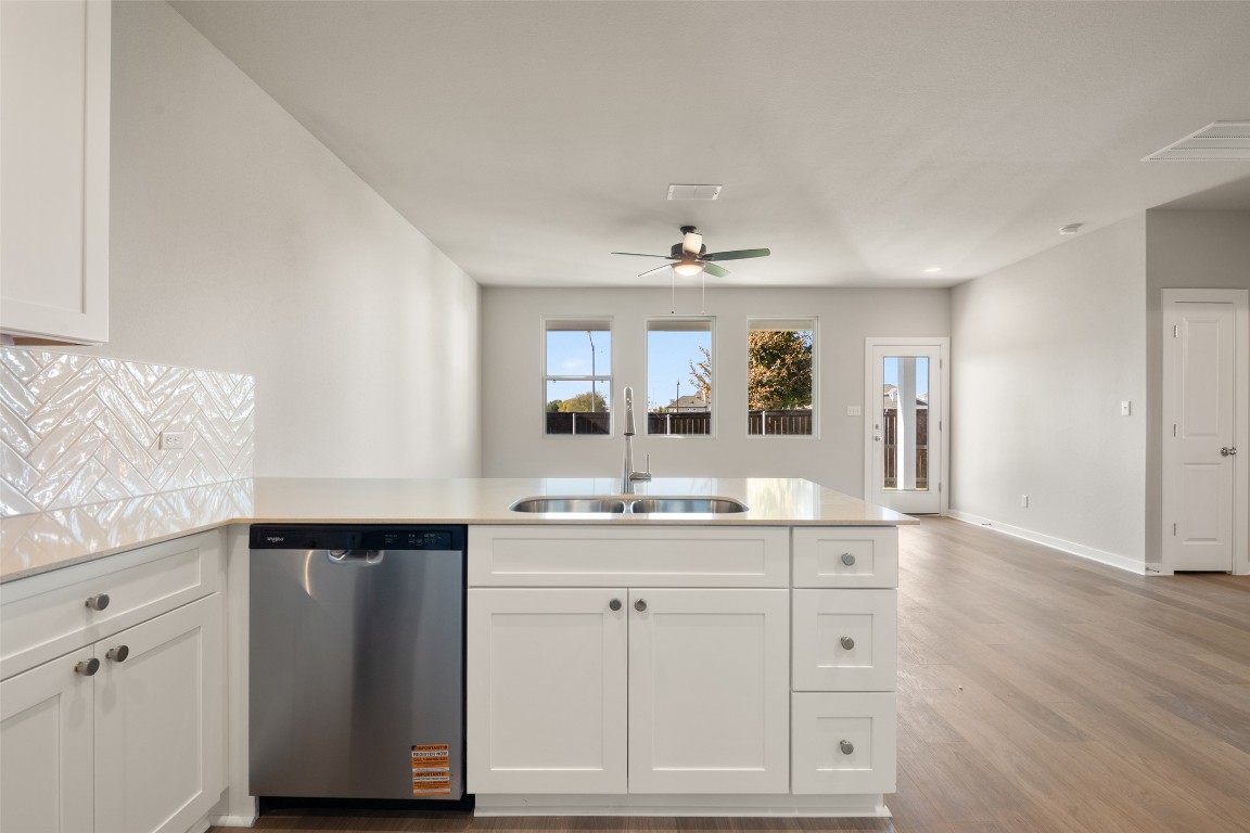 17408 Monastrell Lane Pflugerville, TX 78664 - Photo 7 of 31 a spacious bathroom with a granite countertop sink and a mirror