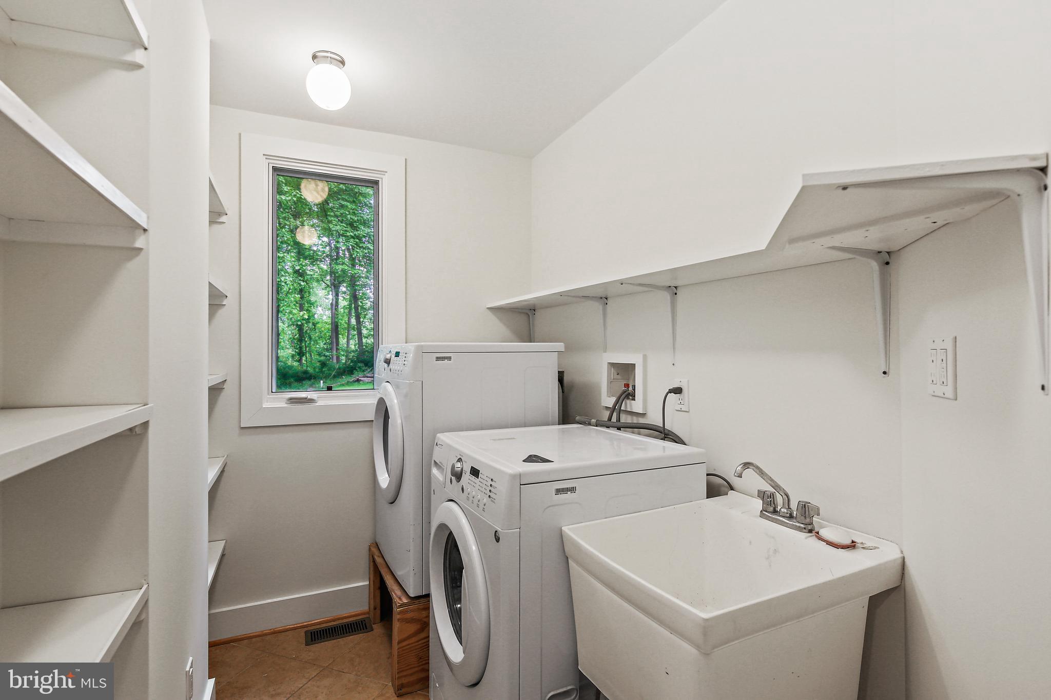 19244 Chandlee Mill Road Sandy Spring, MD 20860 - Photo 40 of 72 In-Law Suite Laundry Room w/Built-Ins
