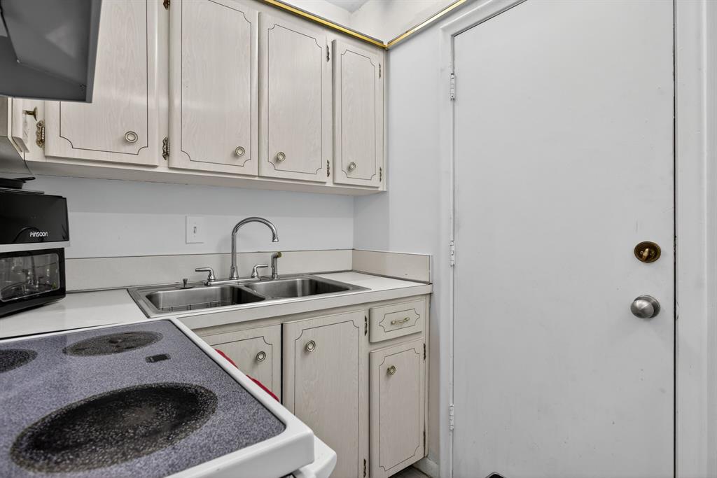 418 South Cypress Road, Unit 110 Pompano Beach, FL 33060 - Photo 11 of 27 a utility room with sink dryer and washer