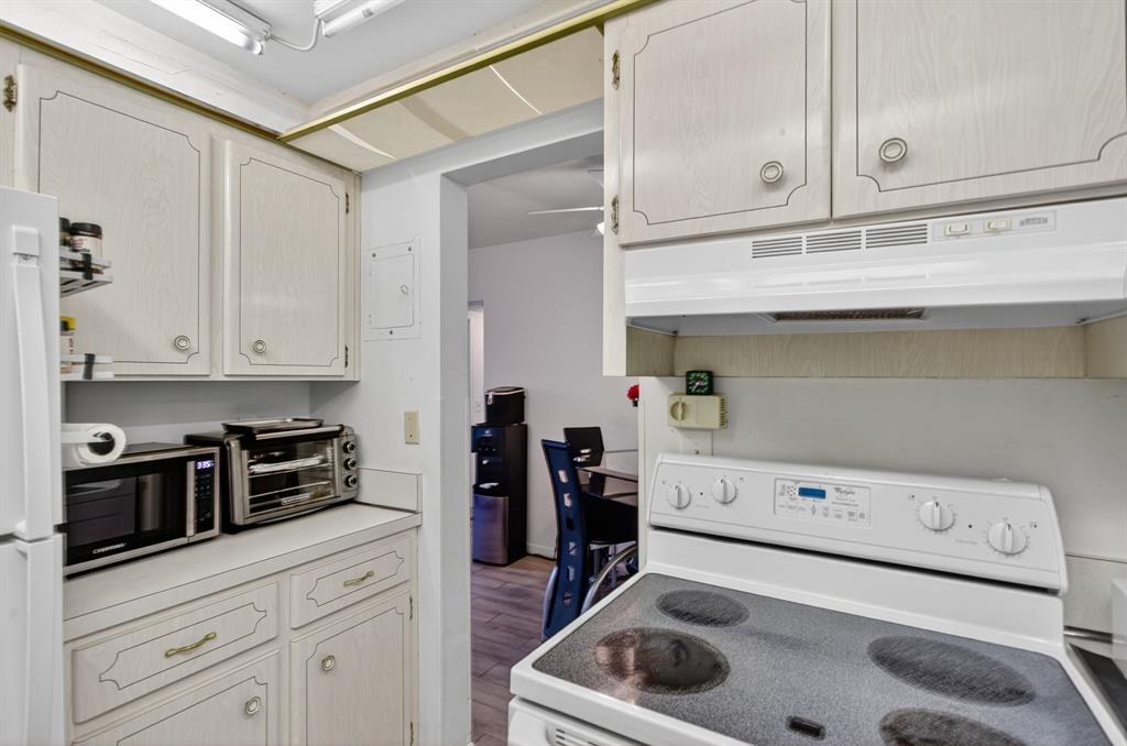 418 South Cypress Road, Unit 110 Pompano Beach, FL 33060 - Photo 13 of 27 a kitchen with a sink and cabinets
