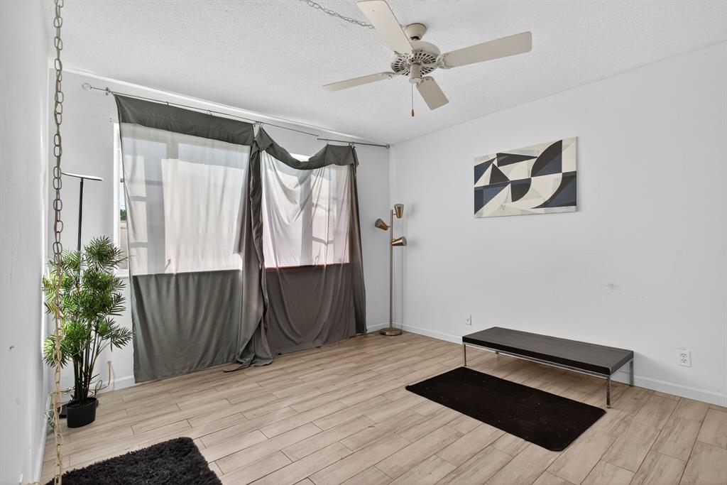 418 South Cypress Road, Unit 110 Pompano Beach, FL 33060 - Photo 16 of 27 a view of entryway with wooden floor