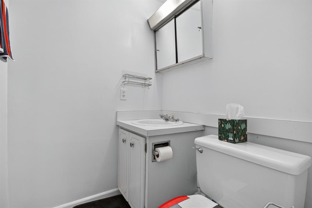 418 South Cypress Road, Unit 110 Pompano Beach, FL 33060 - Photo 18 of 27 a bathroom with a sink and a toilet