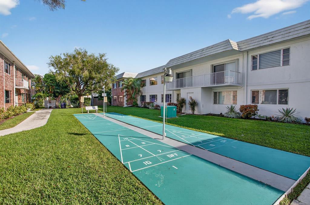 418 South Cypress Road, Unit 110 Pompano Beach, FL 33060 - Photo 23 of 27 a view of a house with a yard
