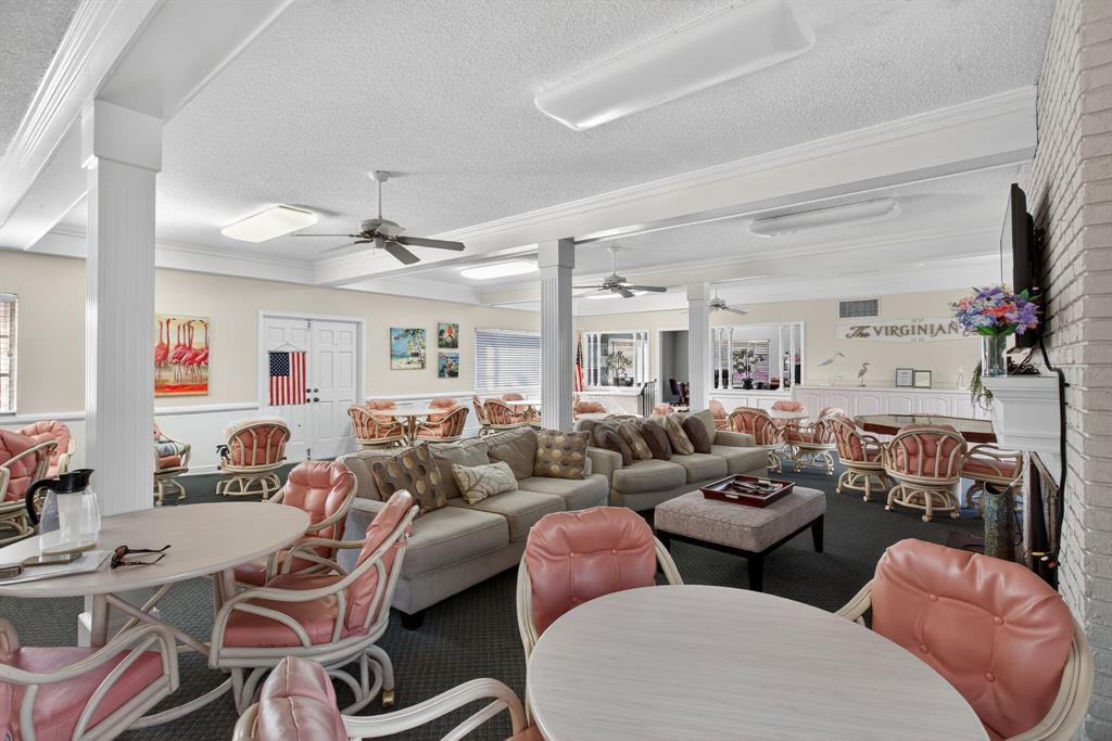 418 South Cypress Road, Unit 110 Pompano Beach, FL 33060 - Photo 26 of 27 a living room with furniture a ceiling fan and a window