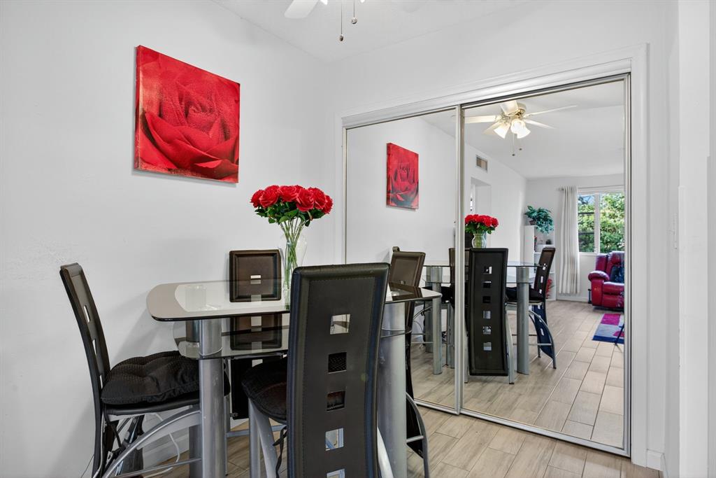 418 South Cypress Road, Unit 110 Pompano Beach, FL 33060 - Photo 6 of 27 a view of a dining room with furniture