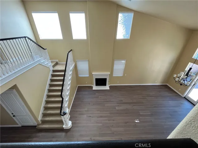 a view of an entryway with wooden floor