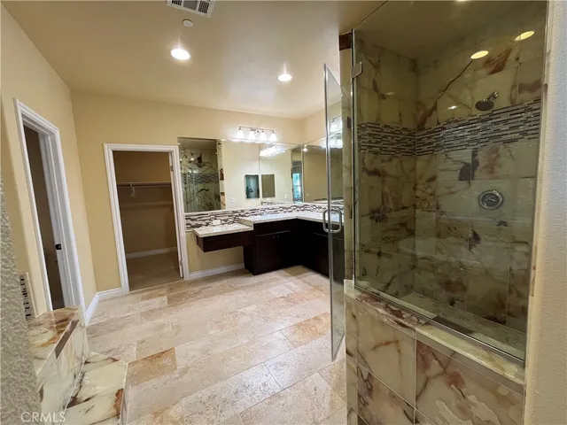 a bathroom with a sink and shower