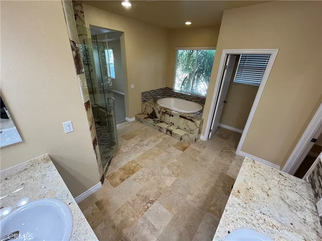 a view of a hallway with furniture
