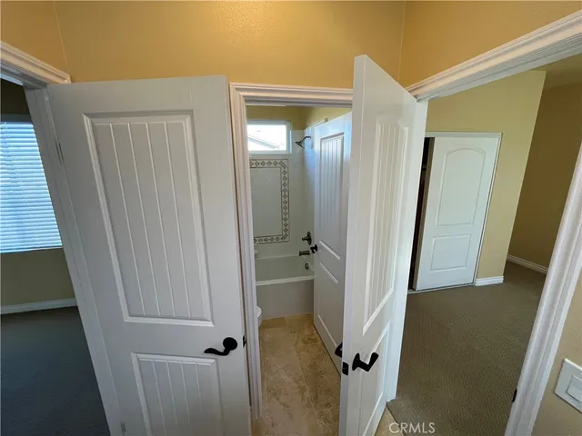 a bathroom with a tub and shower