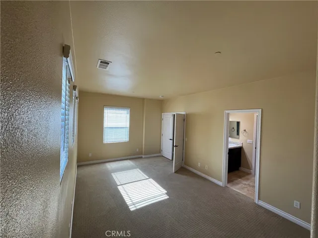 a view of empty room with windows