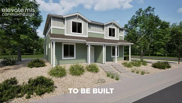 a front view of a house with yard