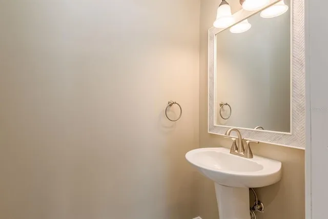 a bathroom with a toilet and a shower curtain
