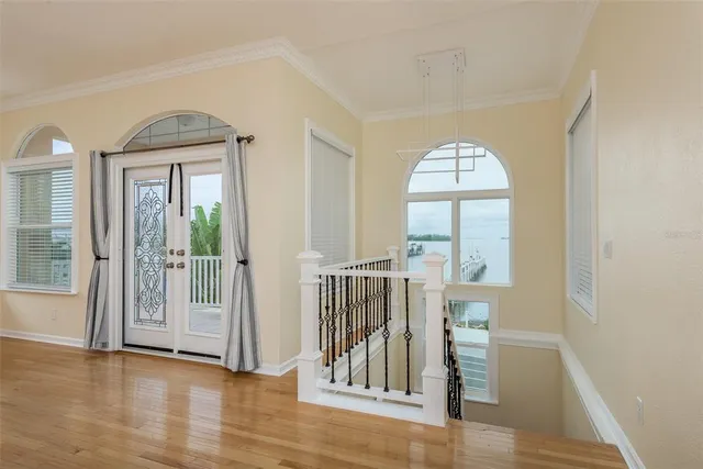 a view of a livingroom with a ceiling fan and window