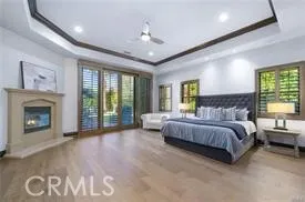 a spacious bedroom with a large bed and a fireplace