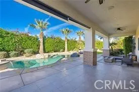 a view of swimming pool with seating space