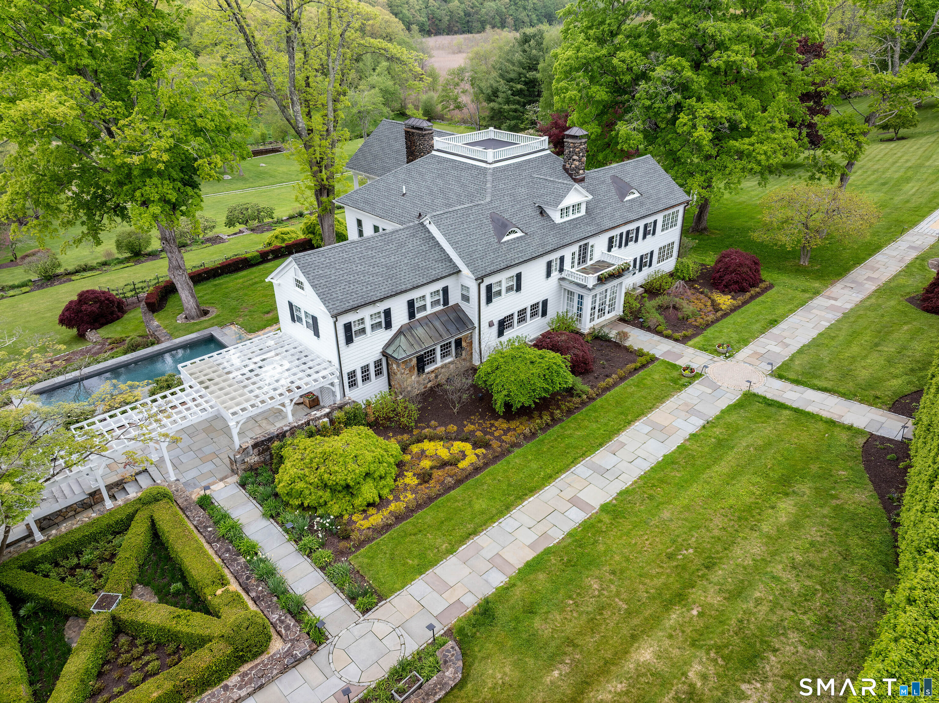 155 Long Ridge Road Danbury, CT 06810 - Photo 3 of 40 The front approach has the formality and symmetry of a true country estate, with broad walks and mature landscaping framing the main house.