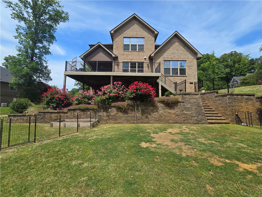 10 Colonel Storrs Court Greer, SC 29650 - Photo 38 of 48 This spacious residence boasts a large deck, perfect for outdoor enjoyment and elegant entertaining.