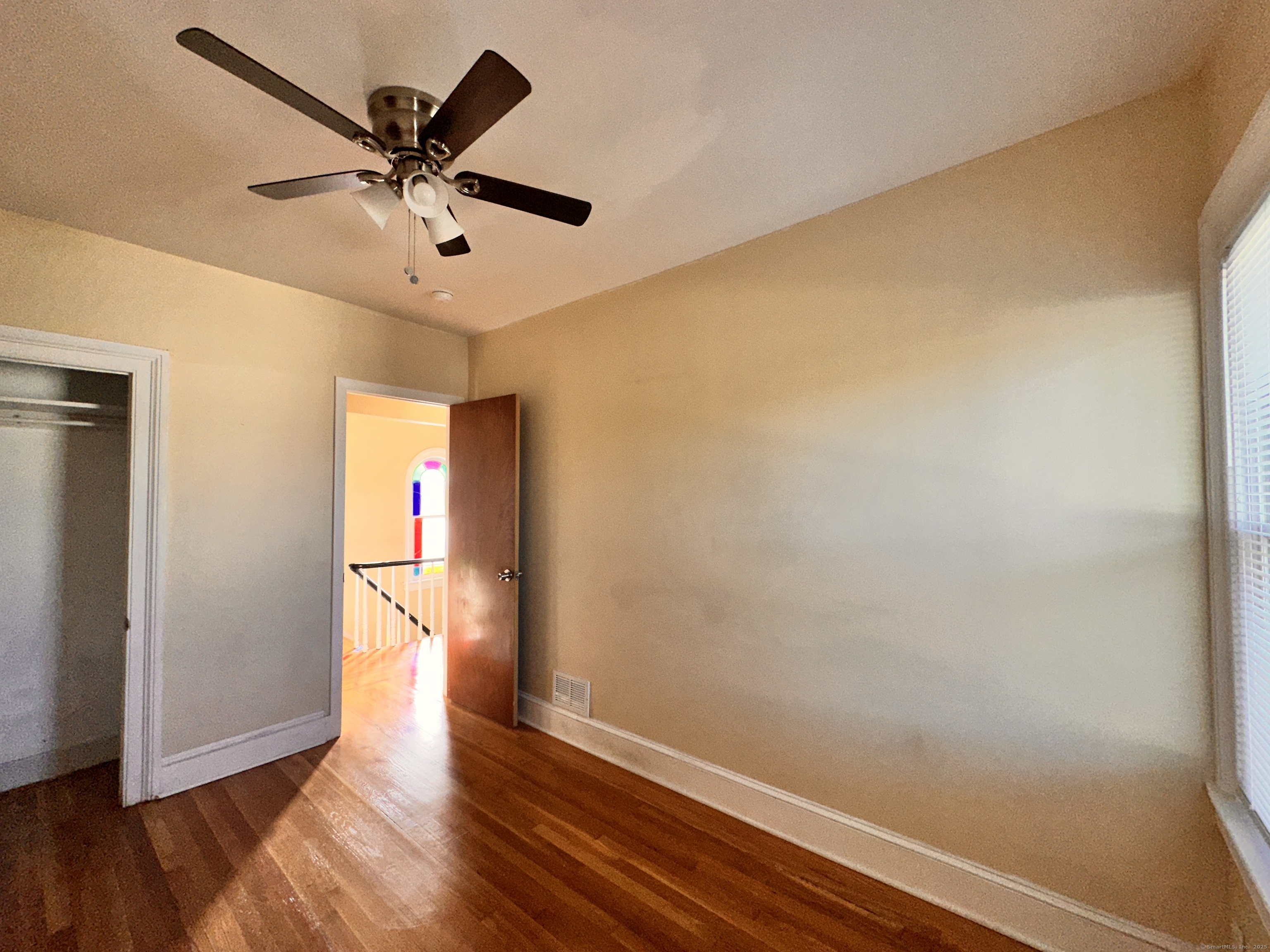 34 North Spring Street Ansonia, CT 06401 - Photo 13 of 20 a view of a big room with wooden floor and windows in a room