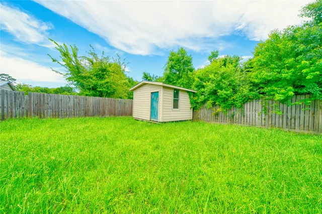 a backyard of a house with lots of green space