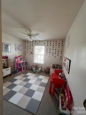 a bathroom with a sink vanity mirror and toilet
