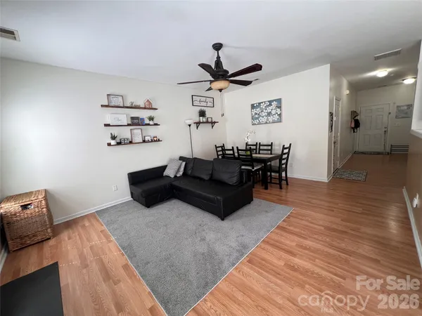 a view of a livingroom with furniture and a flat screen tv