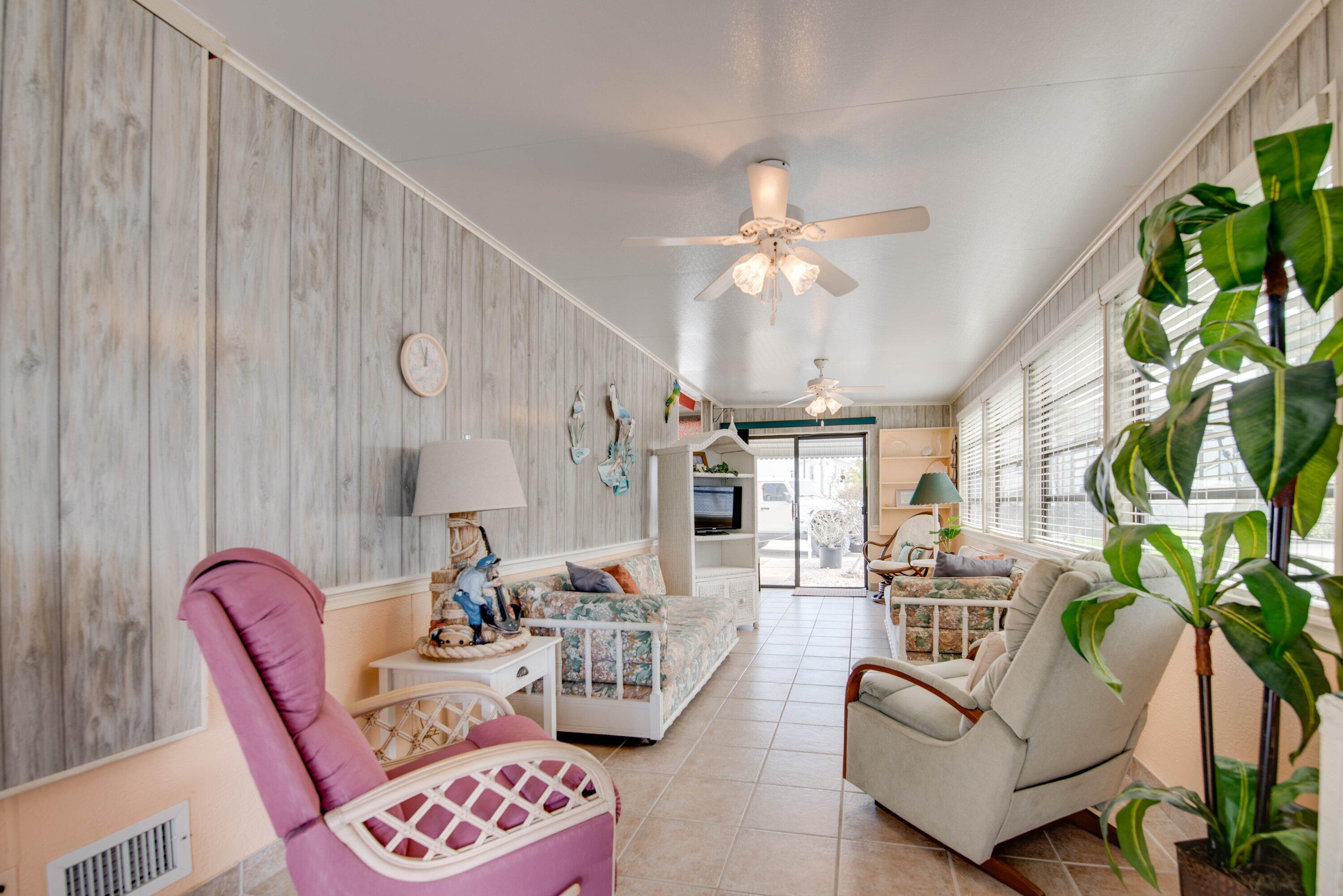 701 Spanish Main Drive, Unit 21 Cudjoe, FL 33042 - Photo 9 of 49 a living room with furniture and a chandelier