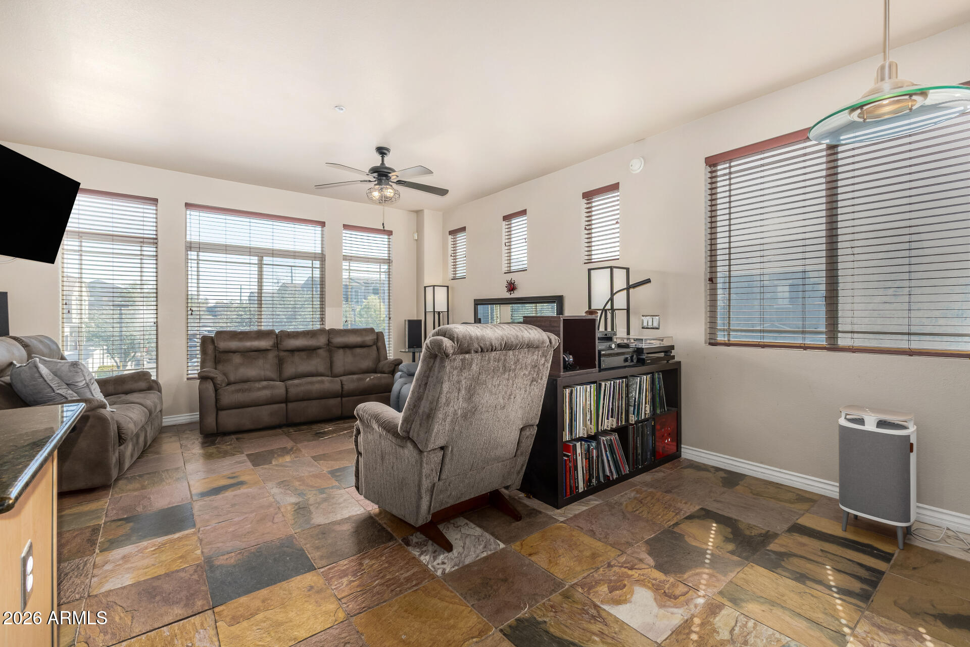 2402 East 5th Street, Unit 1590 Tempe, AZ 85288 - Photo 12 of 33 a living room with furniture and a flat screen tv